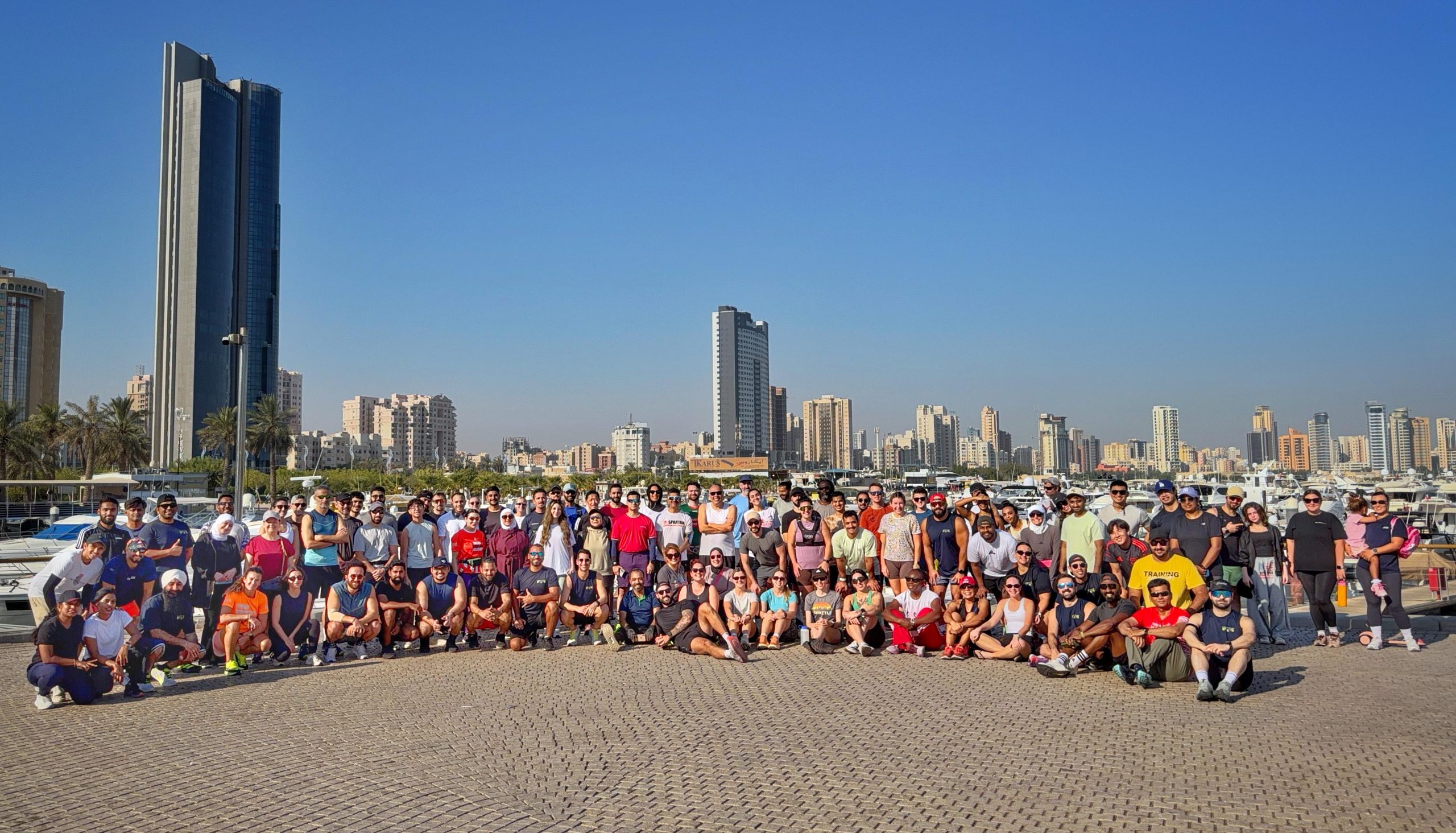 Morning Milers runners gathered together outdoors in Kuwait
